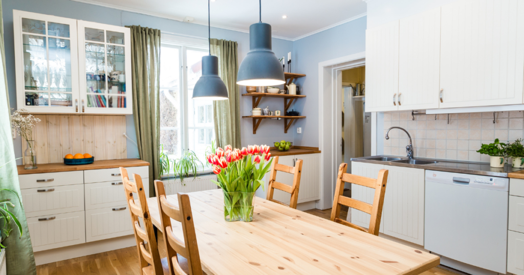 homey modern kitchen with a vase of tulips on the table