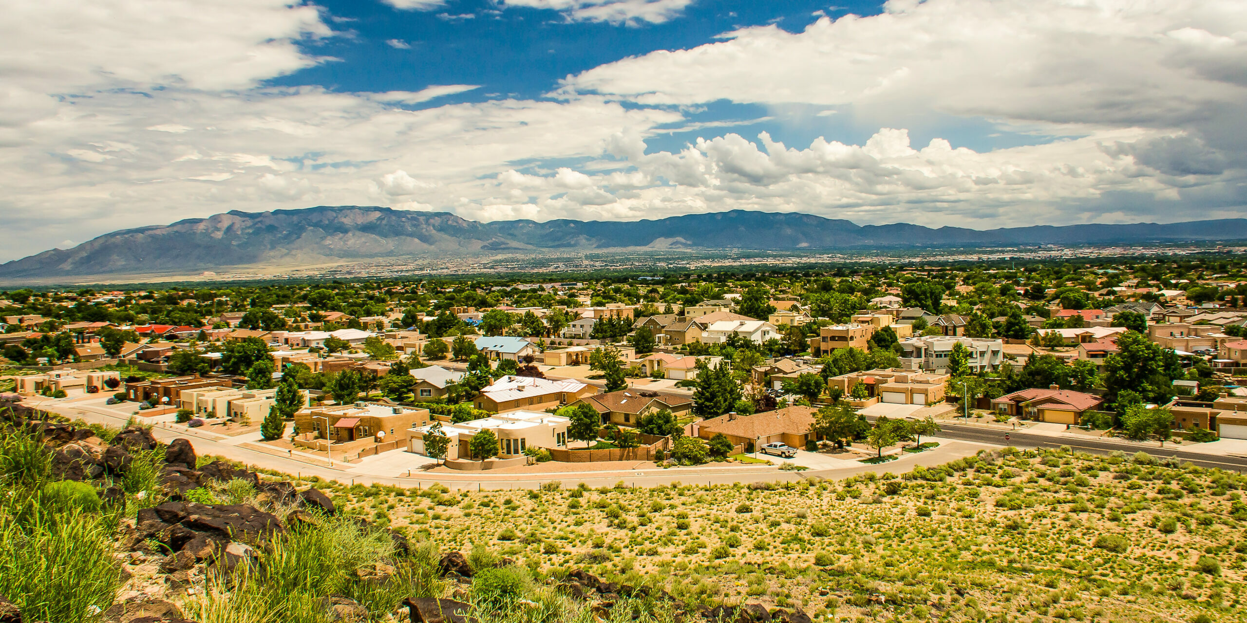 Albuquerque, USA - July 29, 2015: Skyline or cityscape of city with residential suburban houses near Petroglyph National Monument