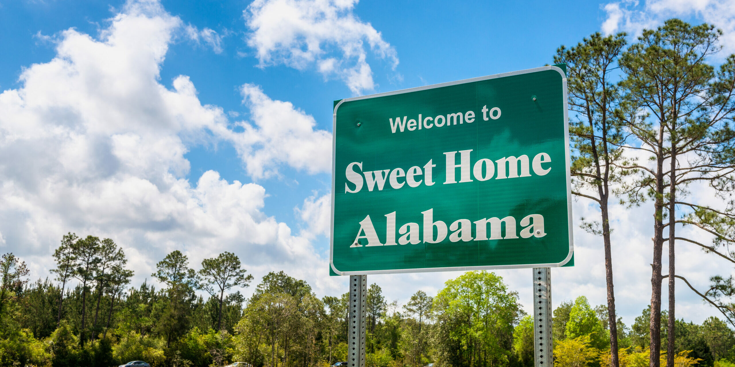 Welcome to Sweet Home Alabama Road Sign along Interstate 10 in Robertsdale, Alabama USA, near the State Border with Florida